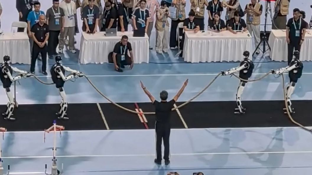 Robots win tug‑of‑war before dramatic tumble at Beijing robot games