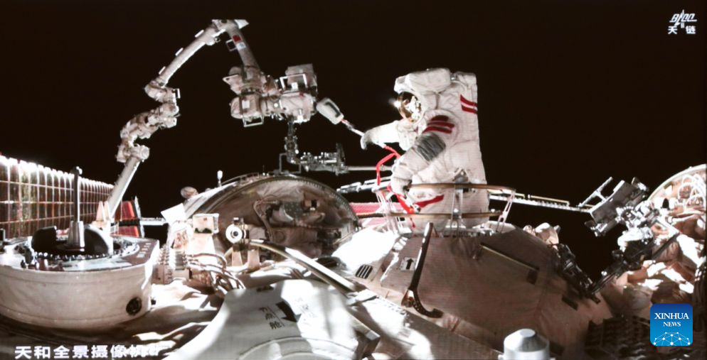 This screen image captured at Beijing Aerospace Control Center on Aug. 28, 2026 shows Shenzhou-23 astronaut Zhu Yangzhu performing extravehicular activities outside China's orbiting space station. The Shenzhou-23 crew aboard China's orbiting space station completed their mission's first series of extravehicular activities on Friday, according to the China Manned Space Agency. (Photo by Yu Liqiang/Xinhua)