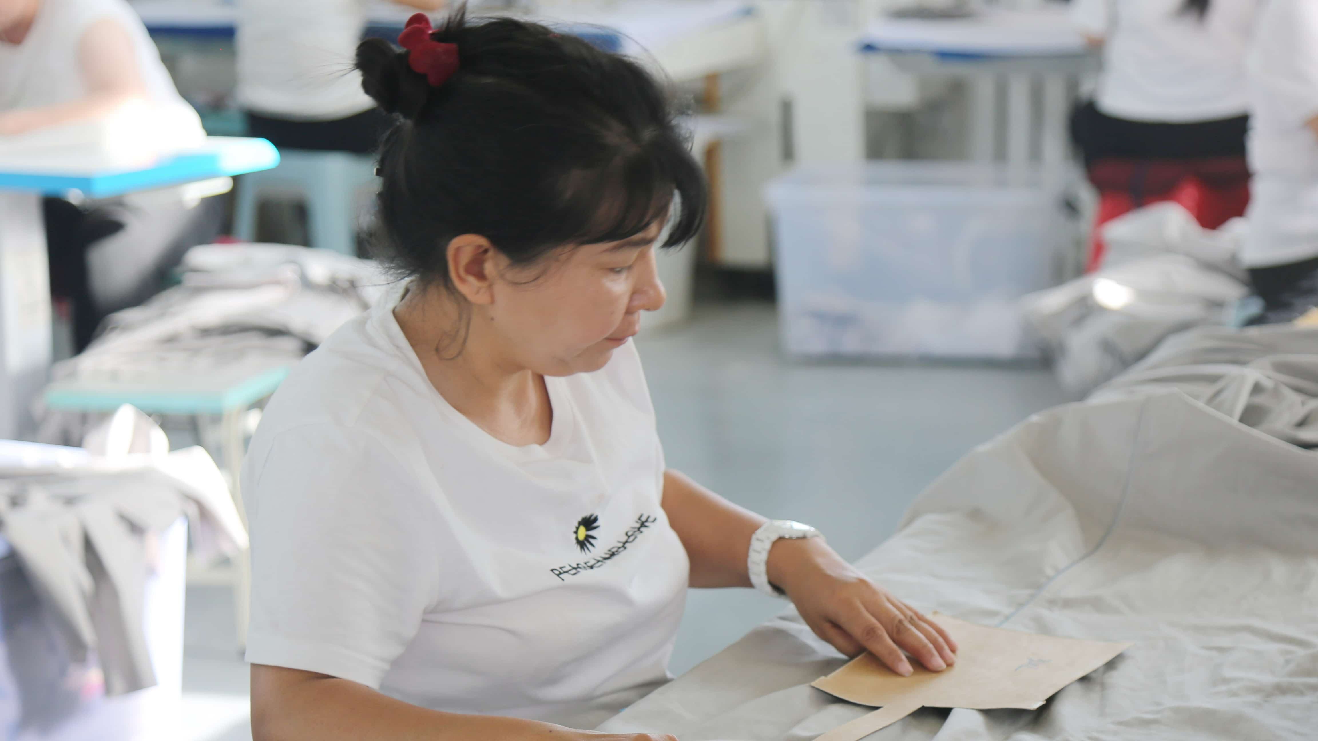 Women in NW China's Xinjiang stitch brighter future at local workshop