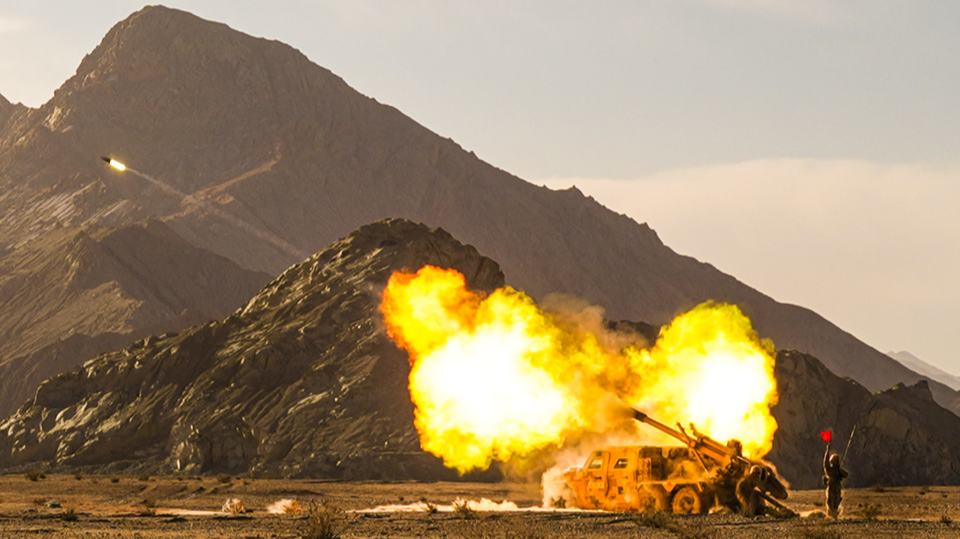 Self-propelled howitzer spits fire on plateau