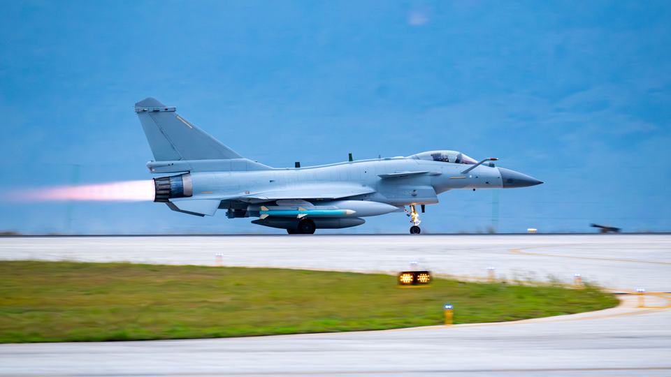 Fighter jet takes off at night