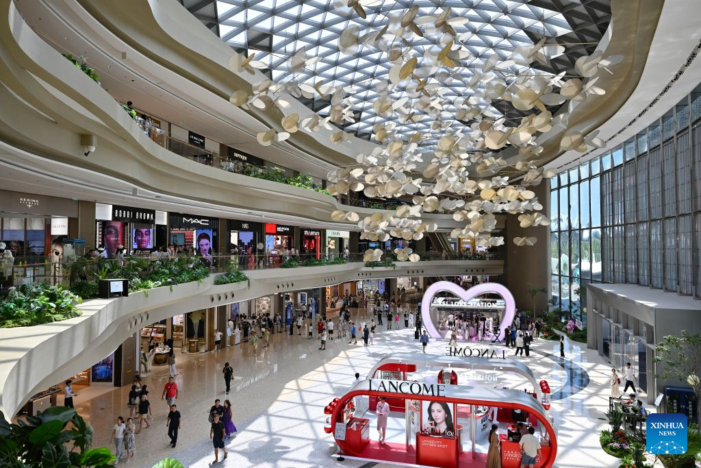 Visitors shop at Sanya International Duty-Free Shopping Complex in Sanya, south China's Hainan Province, Oct. 2, 2026. During the first National Day holiday since the launch of the island-wide special customs operations at Hainan Free Trade Port (FTP), the tropical island has offered visitors from home and abroad a diverse range of experiences -- from duty-free shopping and local food to historic neighborhoods and the distinctive lifestyle of fishing communities. (Xinhua/Guo Cheng)