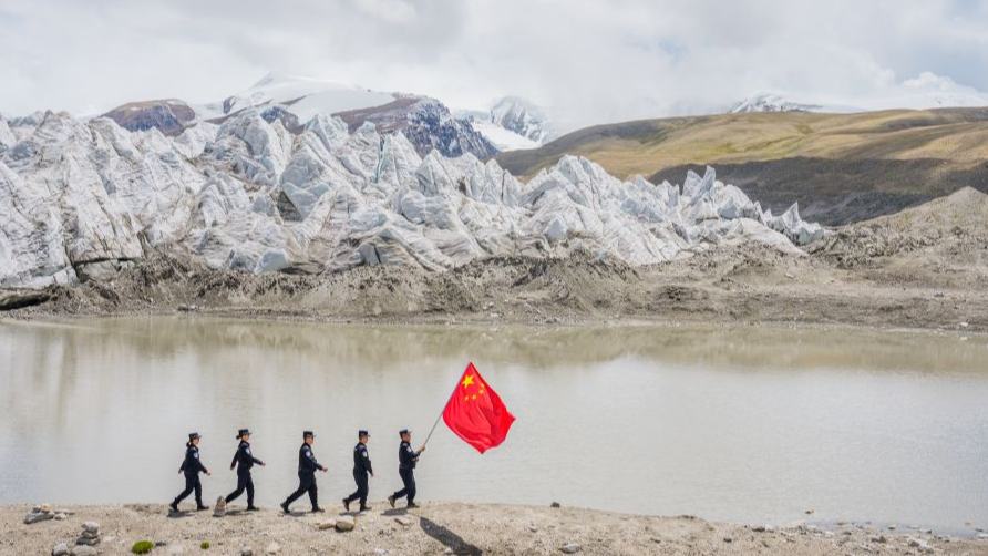 Police officers stand guard at China's highest-altitude border police station