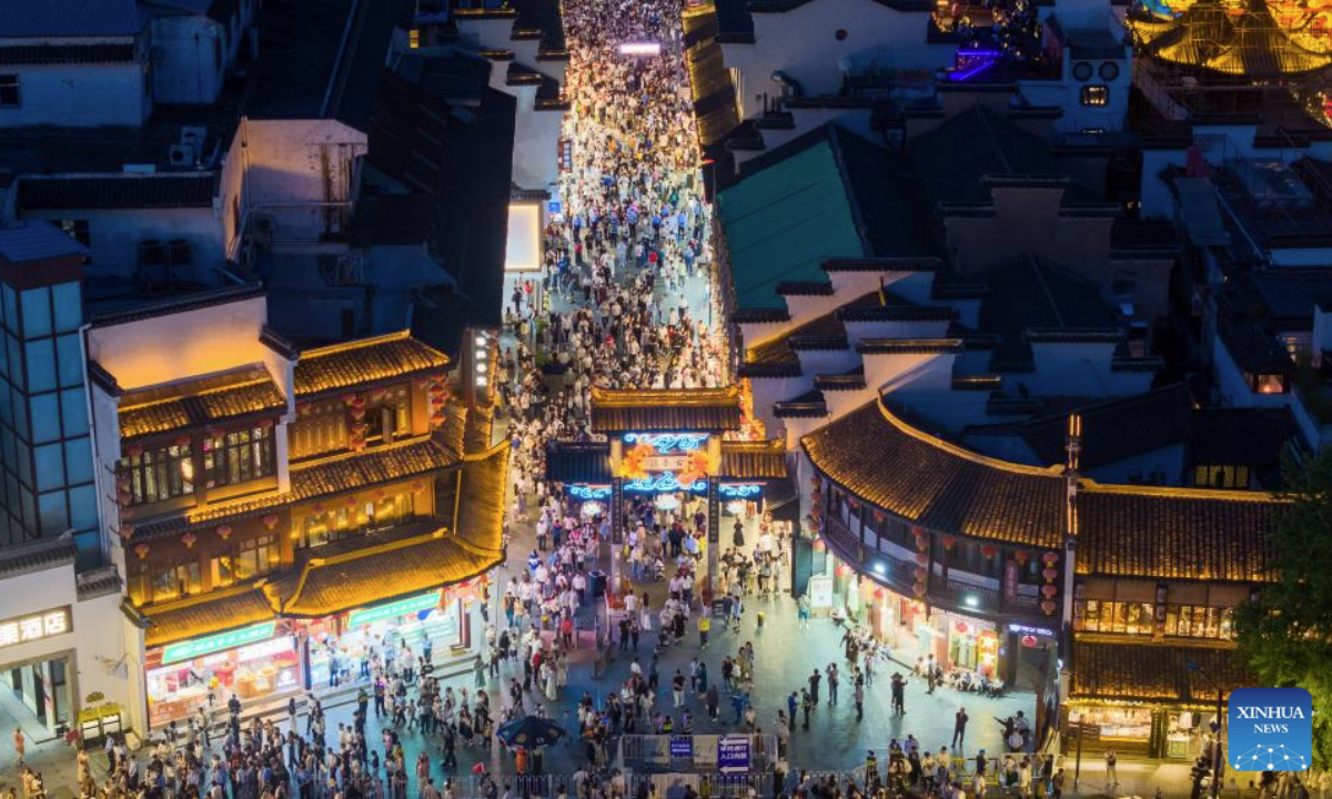 An aerial drone photo taken on May 3, 2025 shows tourists visiting the Fuzimiao scenic area in Nanjing, east China's Jiangsu Province. People across China enjoy the ongoing May Day holiday in various ways. (Xinhua)