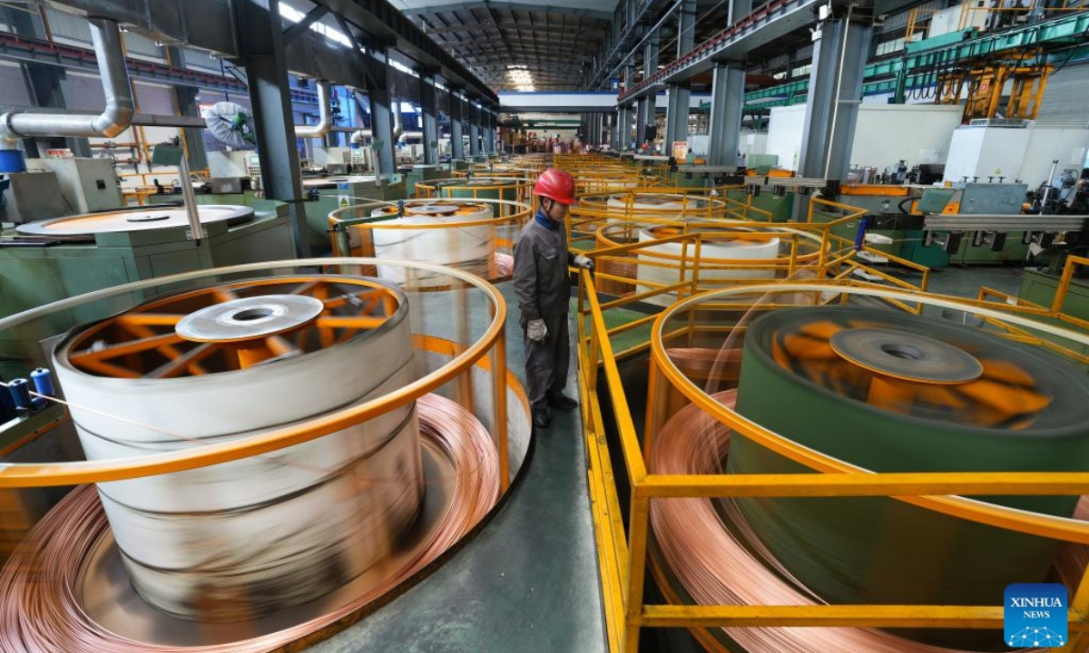 A worker checks a roll of copper pipe at Zhejiang Hailiang Limited in Diankou Town of Zhuji, east China's Zhejiang Province, April 7, 2025. Zhuji has made continuous efforts in promoting the quality development of its private sector in recent years. Home to many state-level high-tech enterprises, the city's value-added industrial output of enterprises above the designated size has maintained growth for 47 consecutive months. (Xinhua/Zheng Huansong)