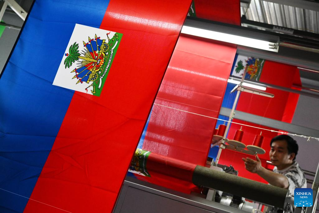Textile factories in China's Shandong busy producing flags as FIFA World Cup approaches