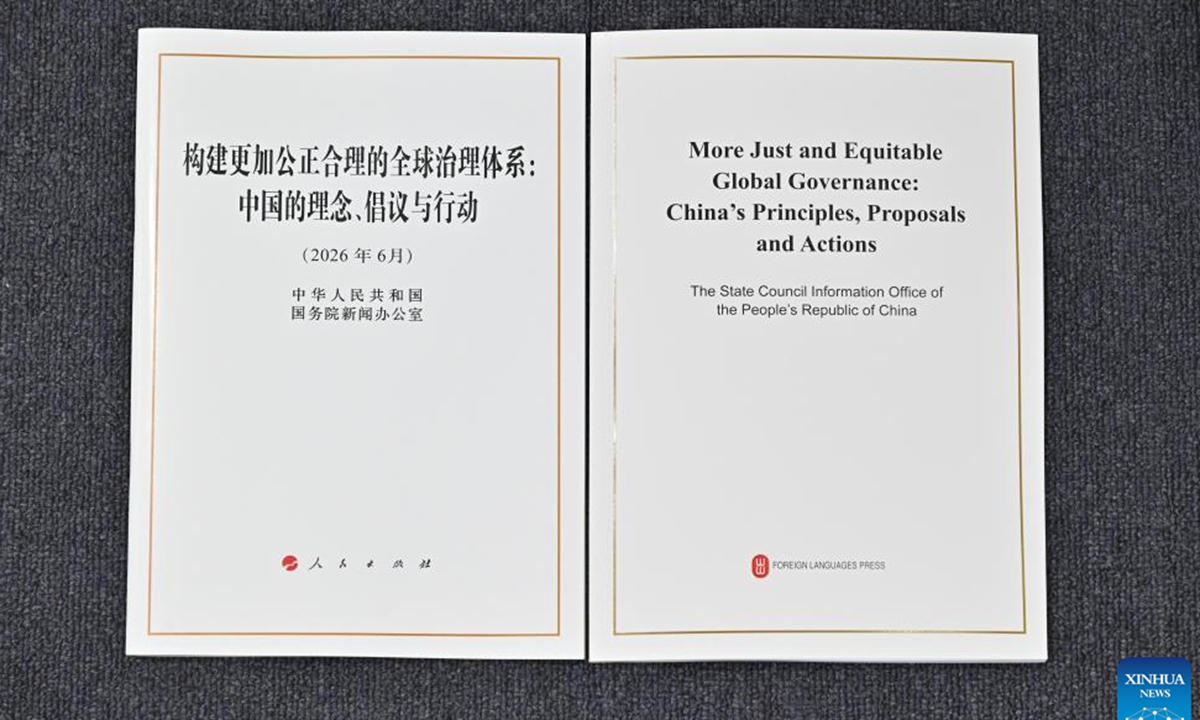 This photo shows the Chinese and English editions of a white paper titled More Just and Equitable Global Governance: China's Principles, Proposals and Actions released by the State Council Information Office (SCIO) on June 17, 2026. Photo: Xinhua